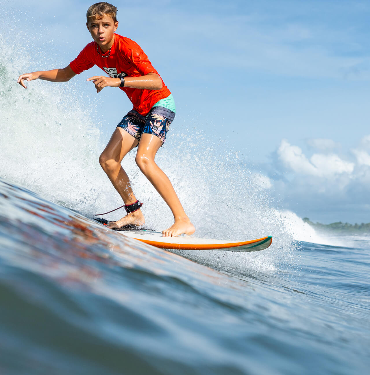Surf Term student riding a wave