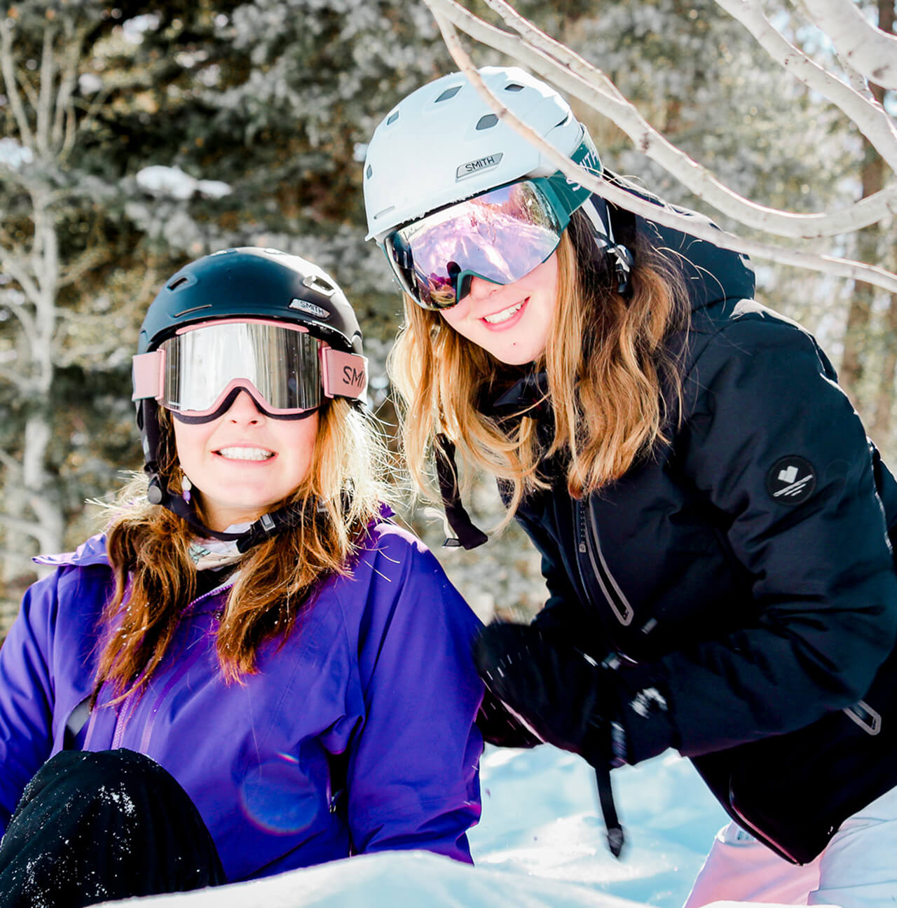 2 kids in ski helmets and goggles
