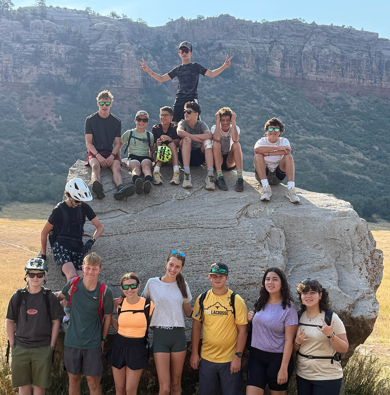 Discover Term students posing on a boulder