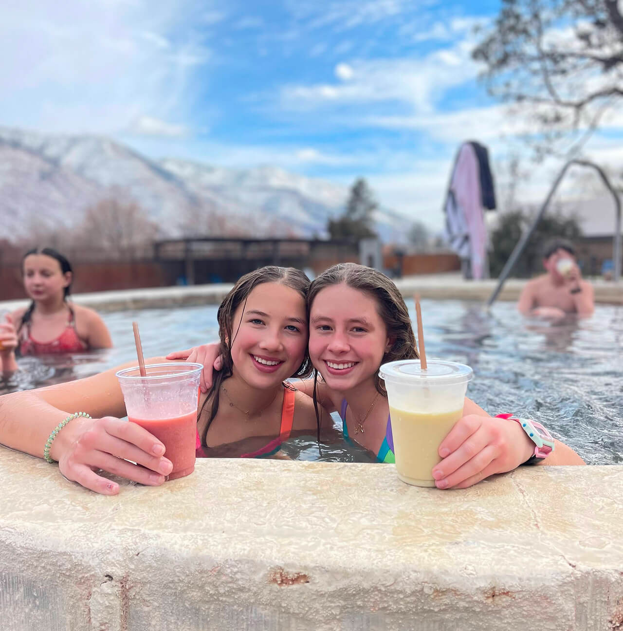 Discover Term students with fruity drinks in a hot spring