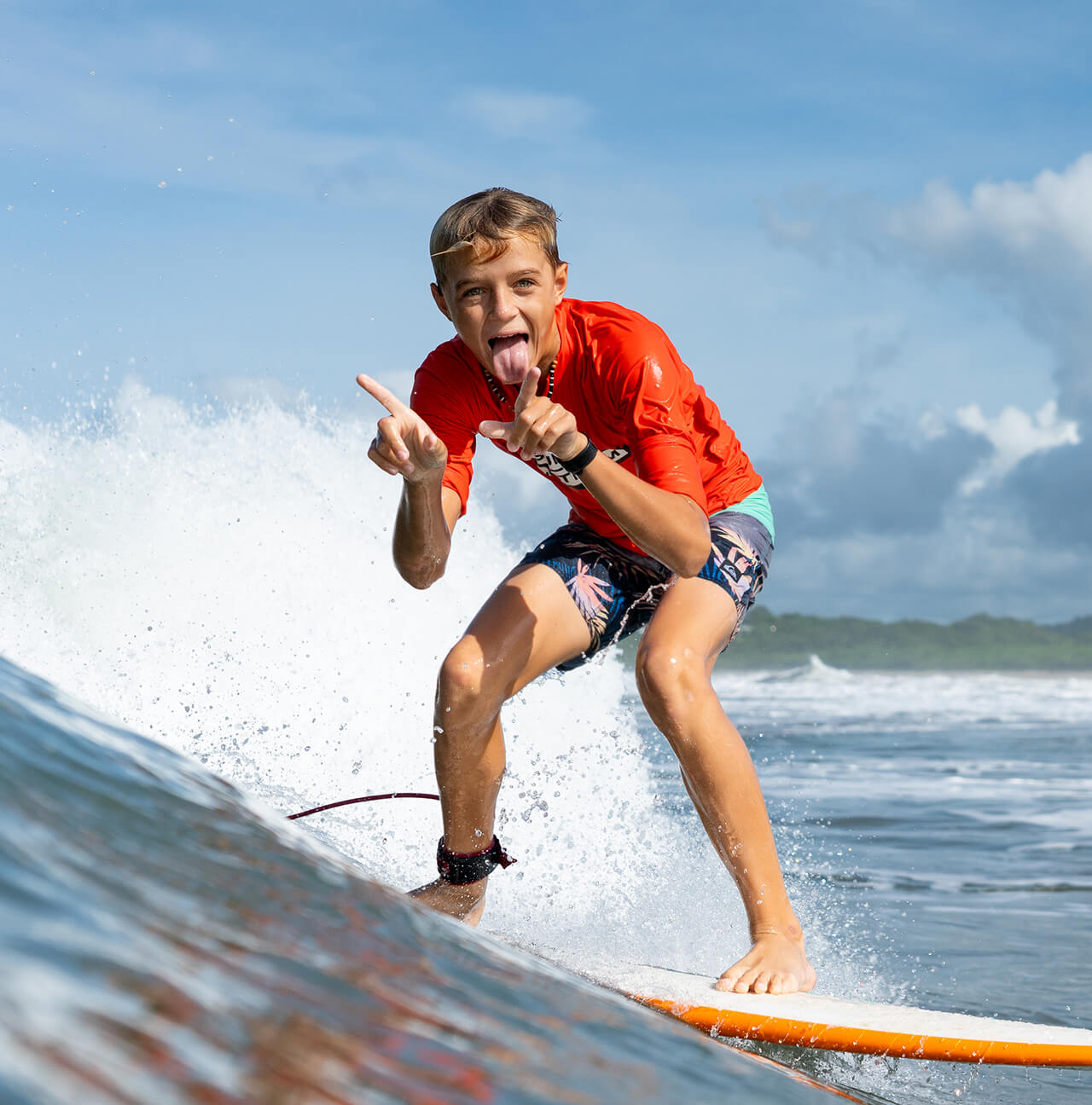 A Discover Term student rides a wave in Costa Rica