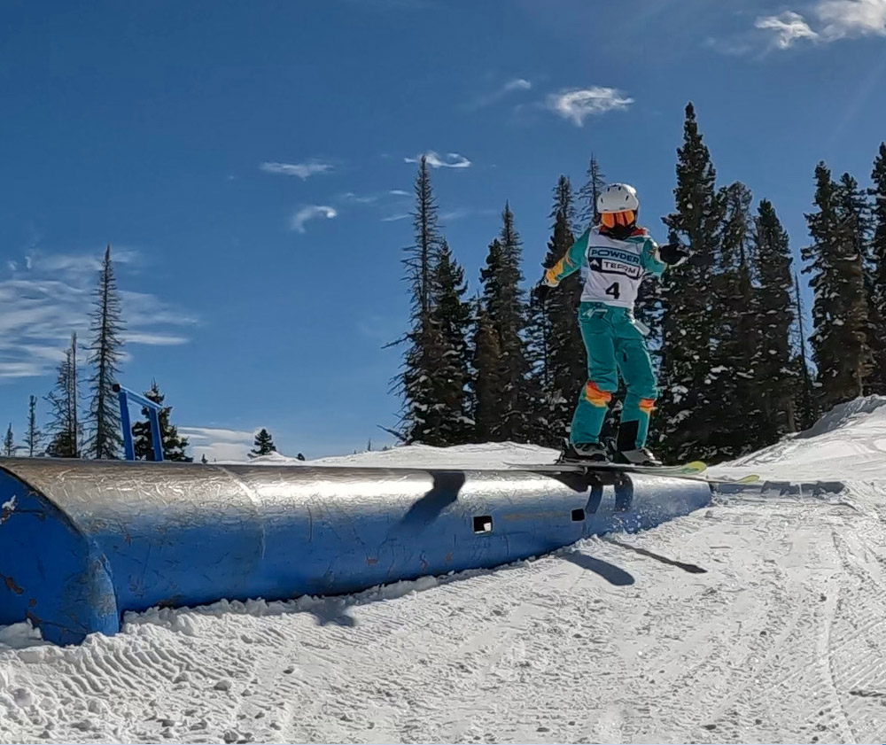 Teen skiing a pipe rail during Adventure Experience