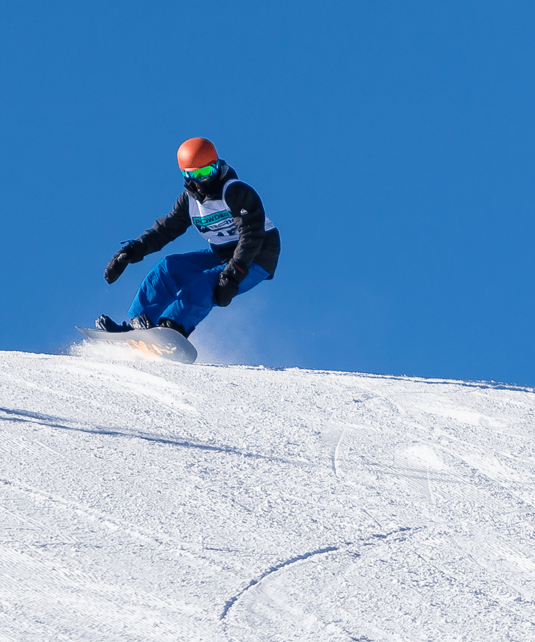 A Powder Term student snowboards.
